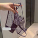 A hand holds up a dark purple lace and mesh panties set with adjustable straps and bow details, set against an indoor background with a visible SANZHIMAO UNDERWEAR watermark.
