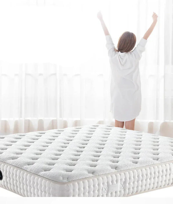 Woman standing on a white mattress with text about sleep quality.