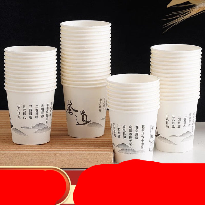 Five stacks of white paper cups with black Chinese calligraphy and mountain illustrations, displayed on a wooden block against a dark background with a red and gold promotional banner at the bottom.