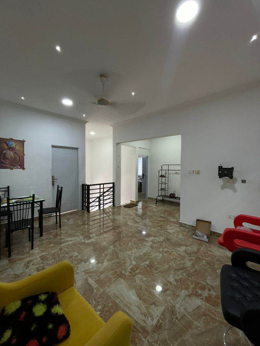 Living room with marble floor, yellow chair, and red couch