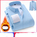 Folded light blue shirt with white lining on a white background