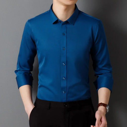 Blue dress shirt worn by a person on a gray background