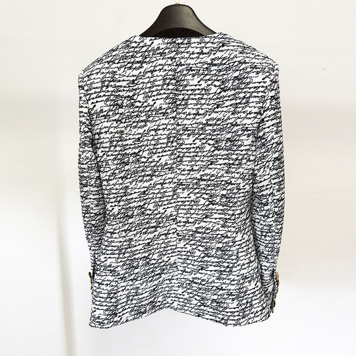 Black and white patterned shirt on a mannequin against a white background