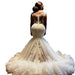 White wedding dress with intricate detailing on a white background