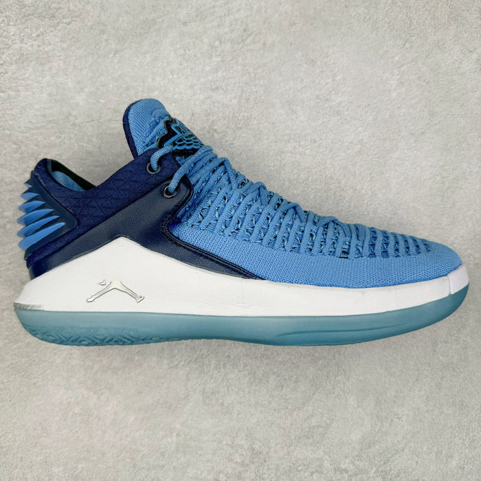 Blue and white sneaker on a light gray background