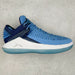 Blue and white sneaker on a light gray background