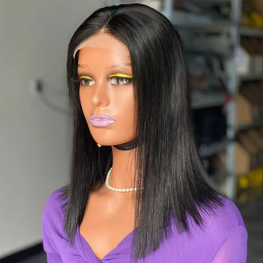 Mannequin head with a black straight wig and purple top in a store setting
