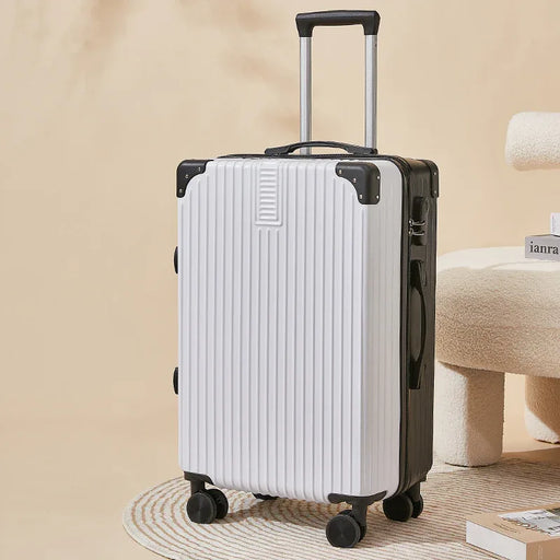 White suitcase with black accents on a beige background
