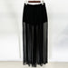 Black sheer skirt on a white background