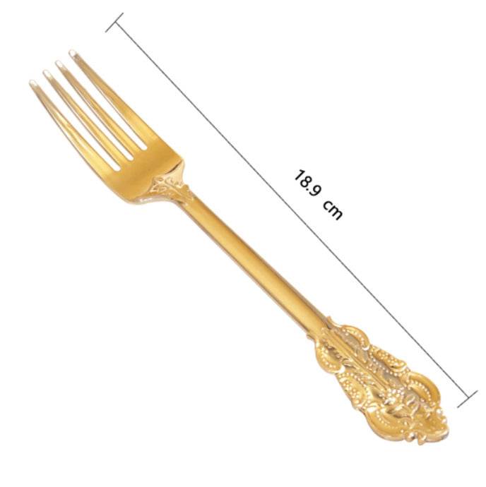 Gold decorative fork with measurements on a white background