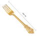 Gold decorative fork with measurements on a white background
