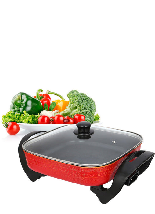 Electric hot pot with vegetables on a white background