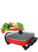 Electric hot pot with vegetables on a white background
