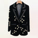Black velvet blazer with floral embroidery on a mannequin against a white background