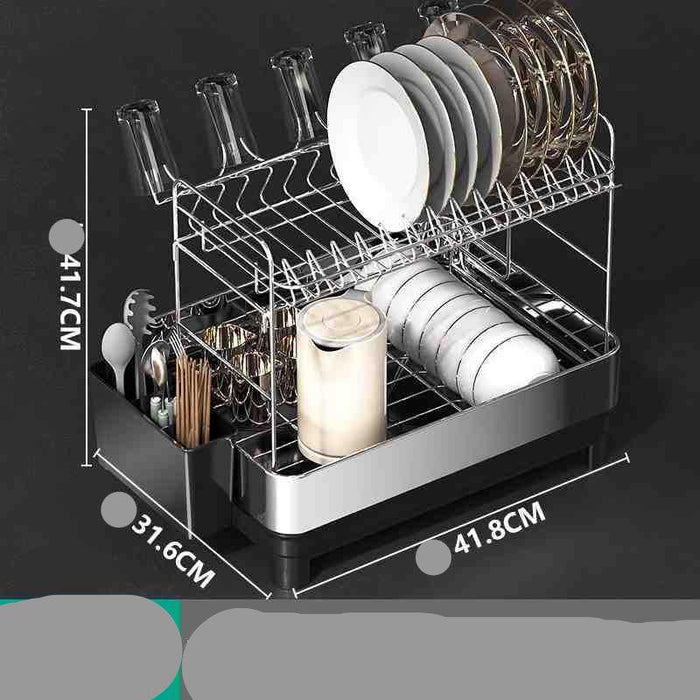 Dish rack with utensils and plates on a black background