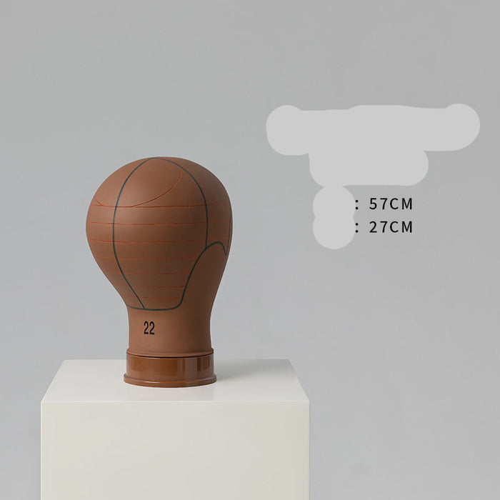 Basketball-shaped mannequin head on a white pedestal with gray background