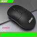 Black Acer mouse on a gray surface with a laptop in the background