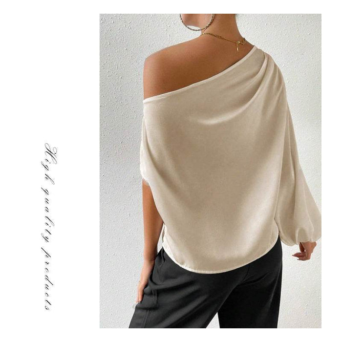 Person wearing a beige off-shoulder top with text on a light gray background