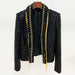 Black textured jacket with gold trim on a white background