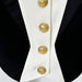 Close-up of a black and white jacket with gold buttons