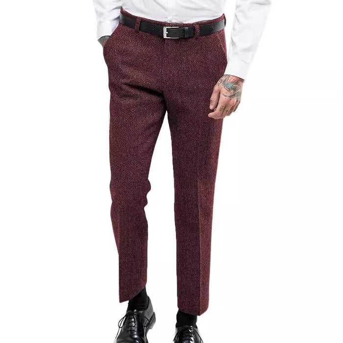 Maroon dress pants worn by a person on a white background