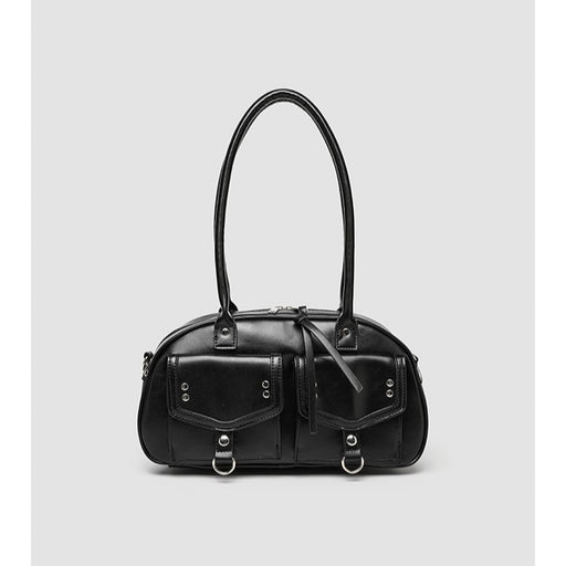 Black handbag with silver hardware on a light gray background