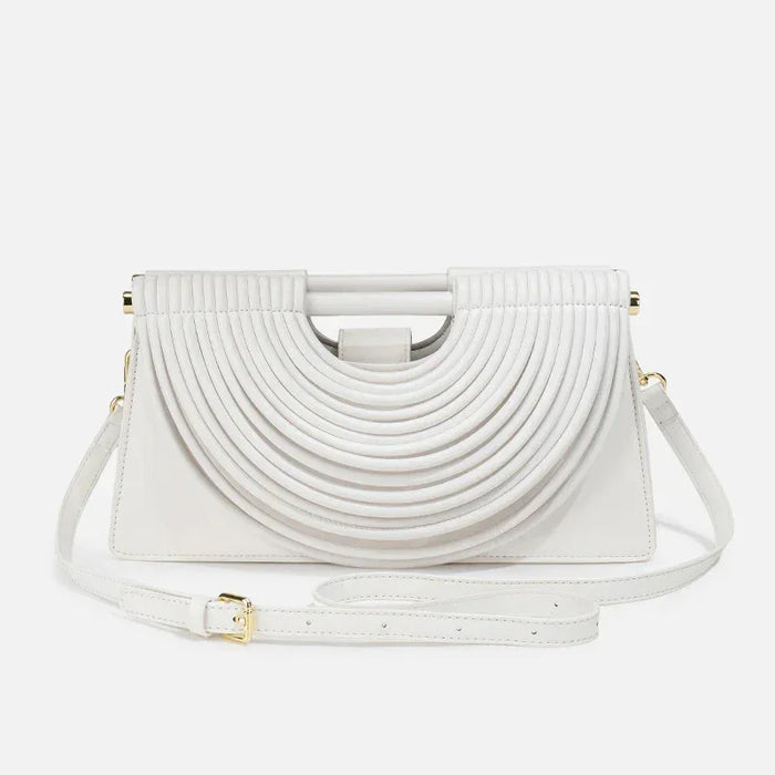 White handbag with a unique design on a white background