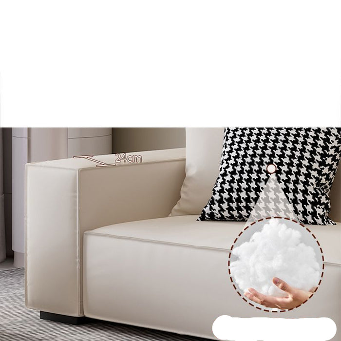 Beige sofa with a black and white patterned pillow, showing a close-up of soft material, and text on a white background.