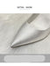 Silver high-heeled shoe with pointed toe on a light background