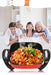 Family sitting together with a steaming pot of food on a table