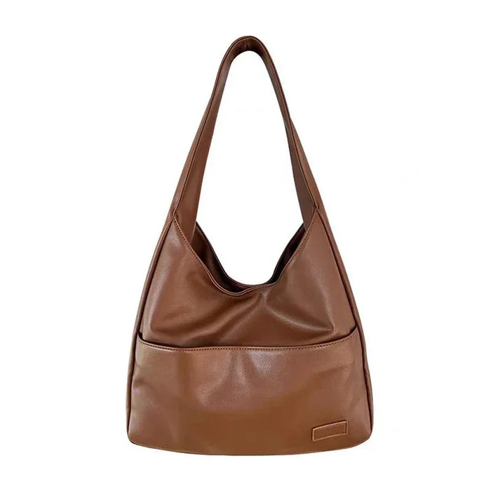 Brown leather handbag on a white background