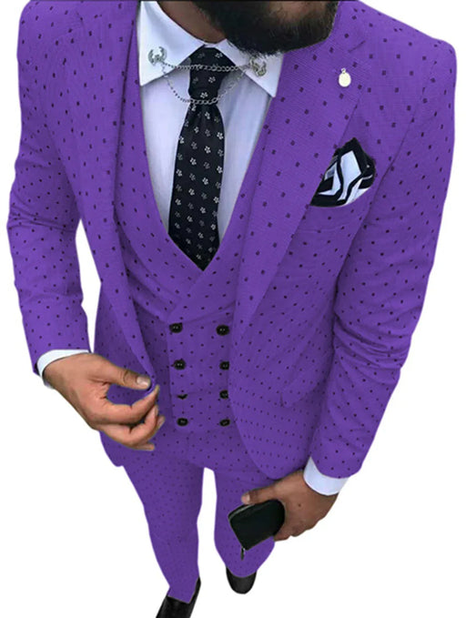 Man wearing a purple polka dot suit with a white shirt and black tie.