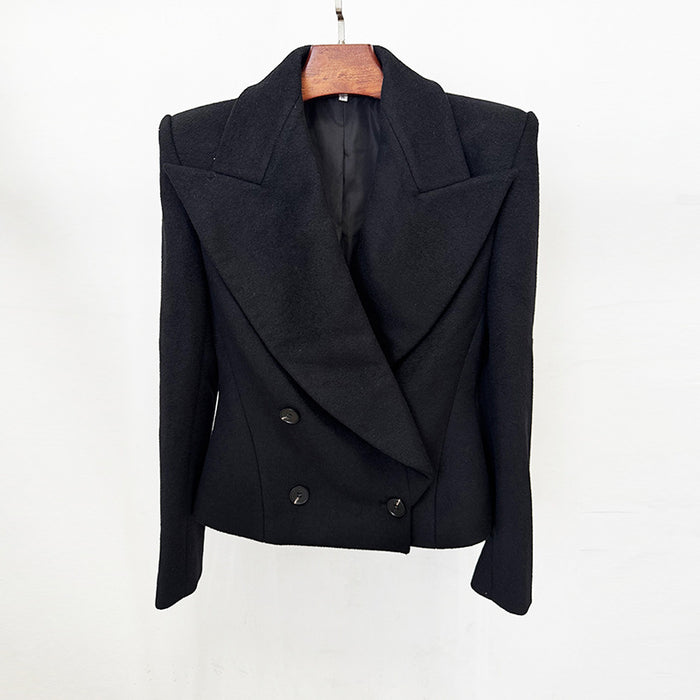 Black jacket on a hanger against a white background