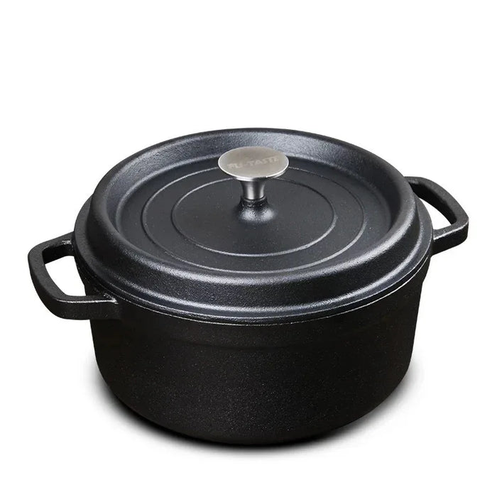 Black cast iron cookware pot with lid on a white background