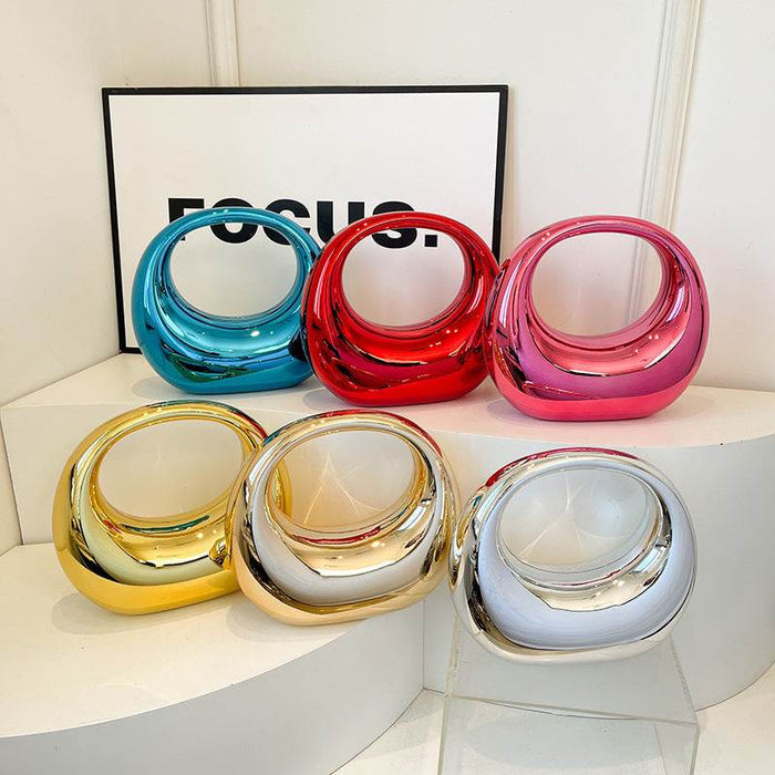 Moon-Shaped Acrylic Handbag: Chic Crescent Clutch for Spring 2025 - Dio Kollections