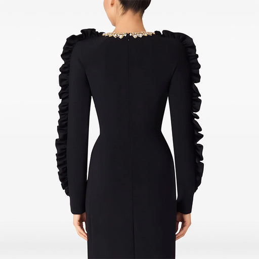 Black dress with ruffled sleeves on a white background