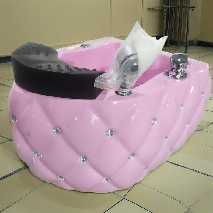 Pink salon chair with decorative elements on a tiled floor.