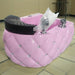 Pink salon chair with decorative elements on a tiled floor.