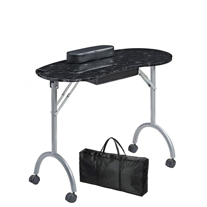Portable nail table with black marble top and carrying bag on a white background