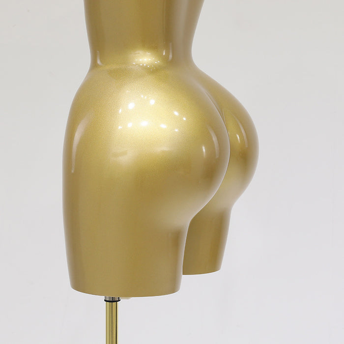 Gold mannequin form on a white background