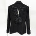 Black blazer with butterfly-shaped sequin design on the back against a white background