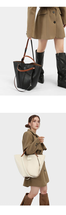 Woman holding a white tote bag with a neutral background