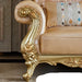 Decorative armchair with gold leaf detailing in a room setting