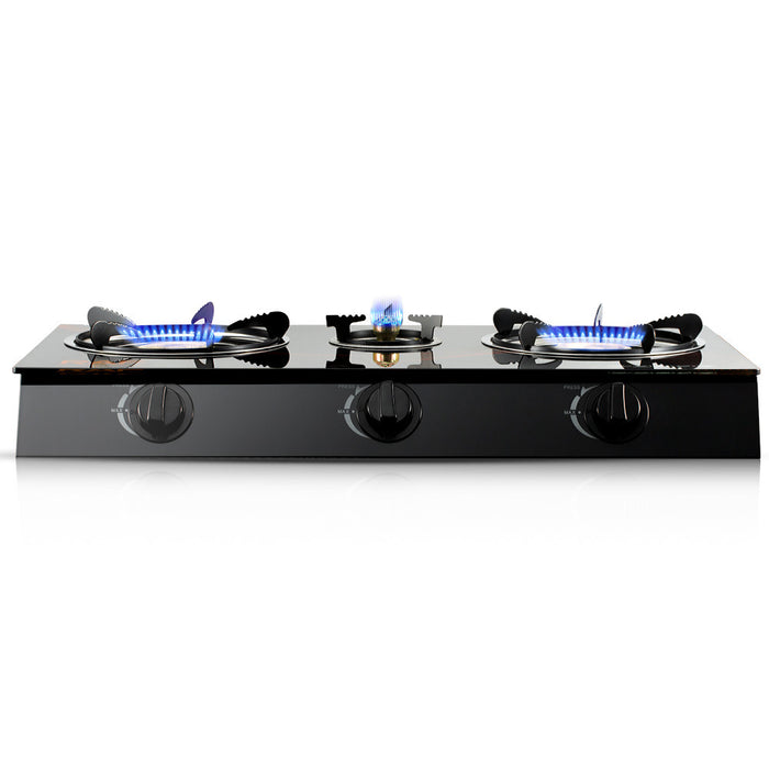 Three-burner gas stove with visible flames on a white background