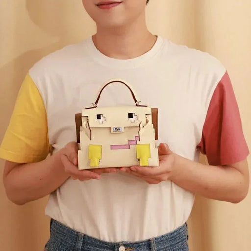 Person holding a pixelated handbag against a beige background