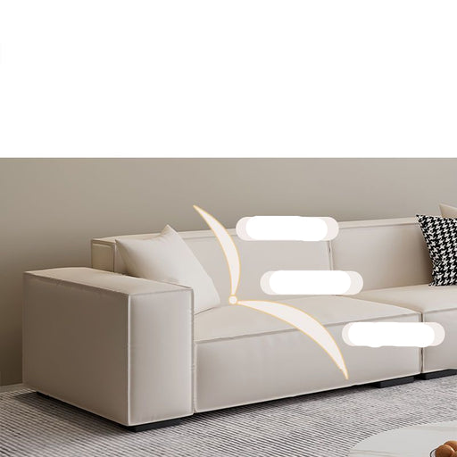 Beige sofa with cushions and text highlighting comfort features on a neutral background