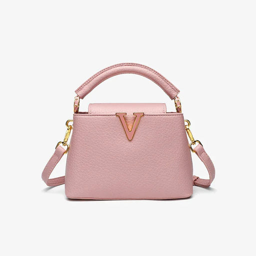 Pink handbag with gold accents on a white background