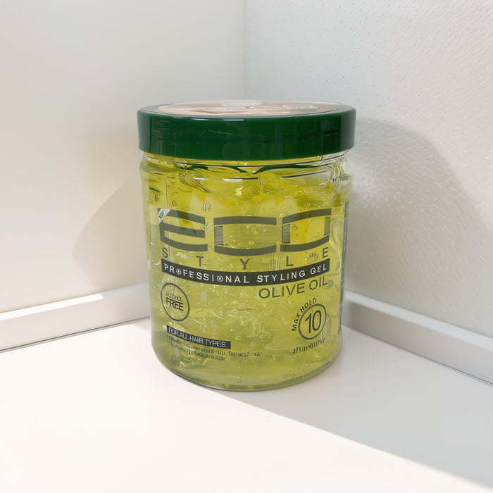 Jar of ECO Styler Olive Oil gel on a white surface with a white background