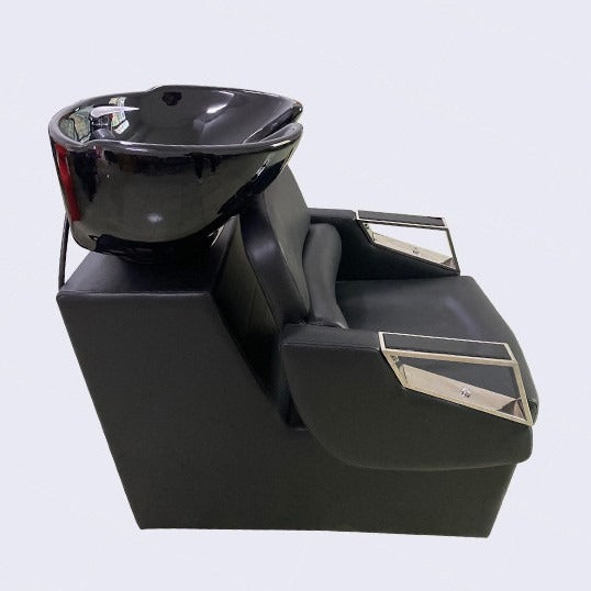 Black hair washing chair with bowl on a light gray background