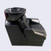 Black hair washing chair with bowl on a light gray background